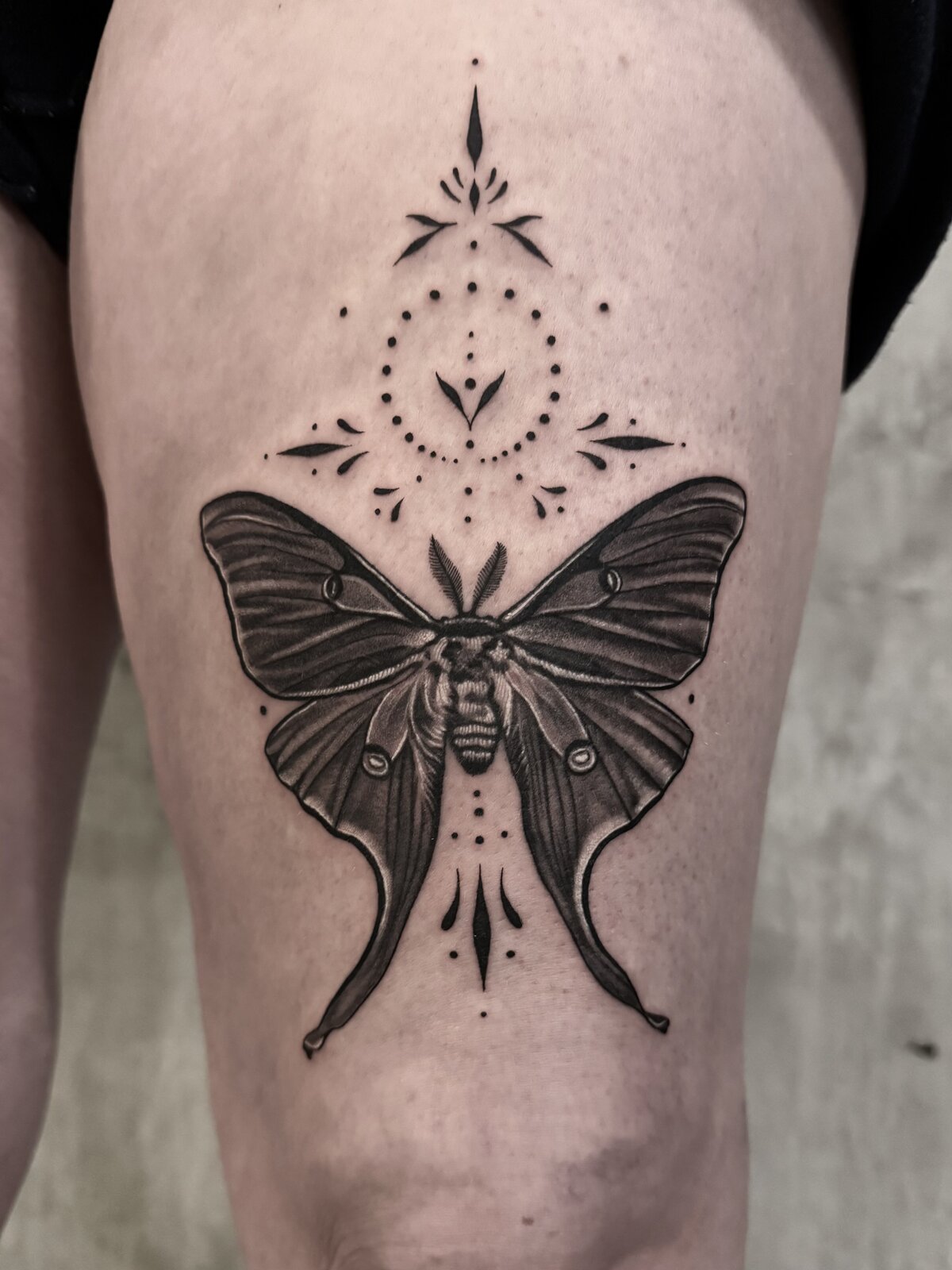 Custom black and grey tattoo by Carli Hall